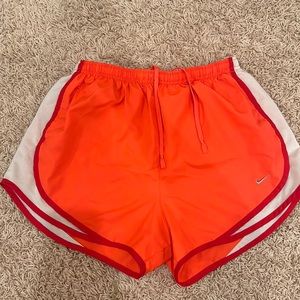 Orange Nike shorts
